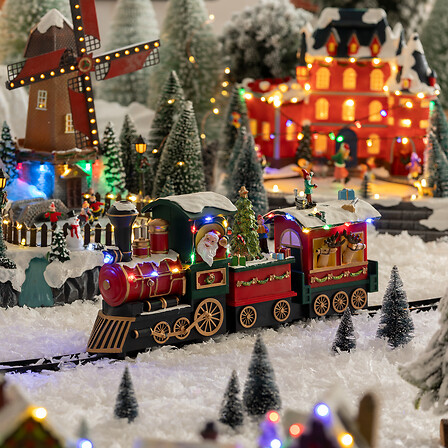 VILLAGE LUMINEUX - TRAIN DU PÈRE NOËL MUSICAL ET LUMINEUX AVEC MOUVEMENT -  18 LEDS - À 3 PILES AAA NON INCLUSES